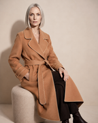 Women's Belted Wrap Coat with Draped Hem in Golden Camel, 03 seated or leaning, worn by model