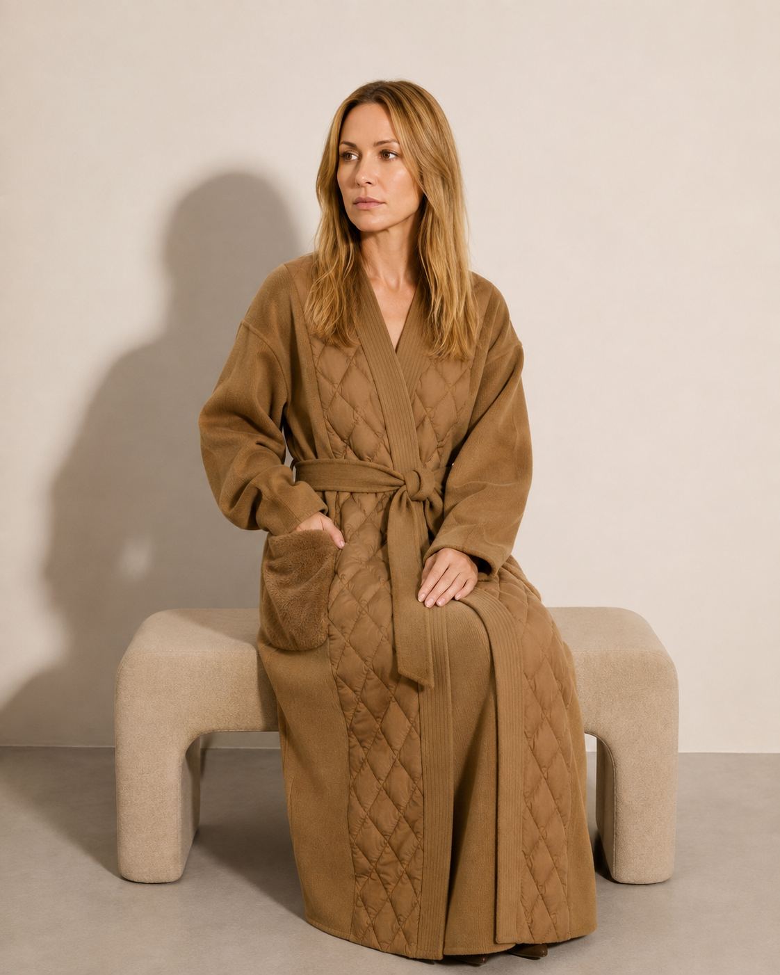 Women's Belted Diamond-Quilted Mid-Length Coat in Khaki, 03 seated or leaning, worn by model