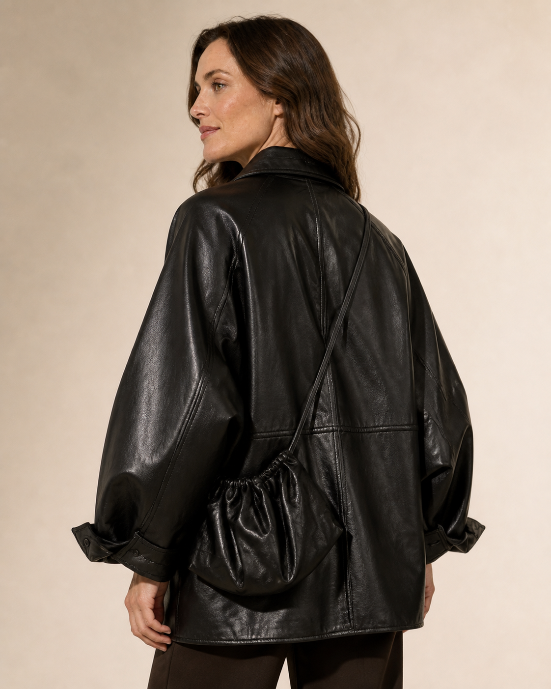 Women's Oversized Faux Leather Utility Jacket with Drawstring in Black With Bag, 04 back or side, worn by model