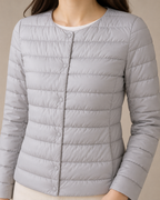 Women's Lightweight Down-Filled Quilted Jacket for Layering in Silver, 05 material macro, worn by model