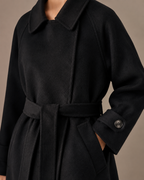 Women's Belted Wool Coat with Chest Flap Pockets in Black, 05 material macro, worn by model