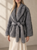 Warm editorial room · Soft sophisticated / old money Grey bust to thigh