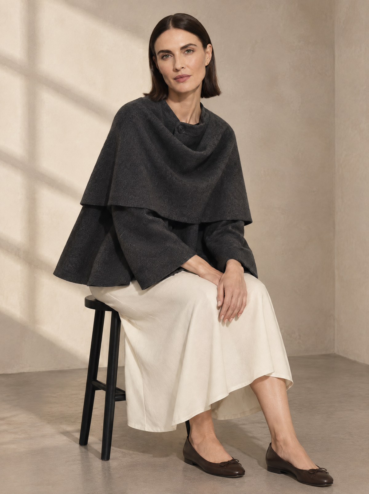 Warm editorial room · Soft sophisticated / old money Grey seated or lean