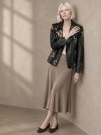 Warm editorial room · Soft sophisticated / old money Black seated or lean