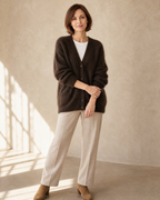Women's V-Neck Button Cardigan with Pockets in Brown, loose arm cross, worn by model