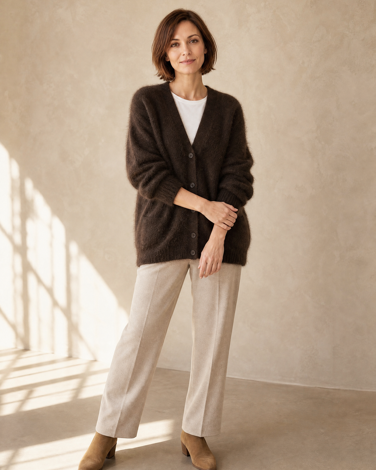 Women's V-Neck Button Cardigan with Pockets in Brown, loose arm cross, worn by model