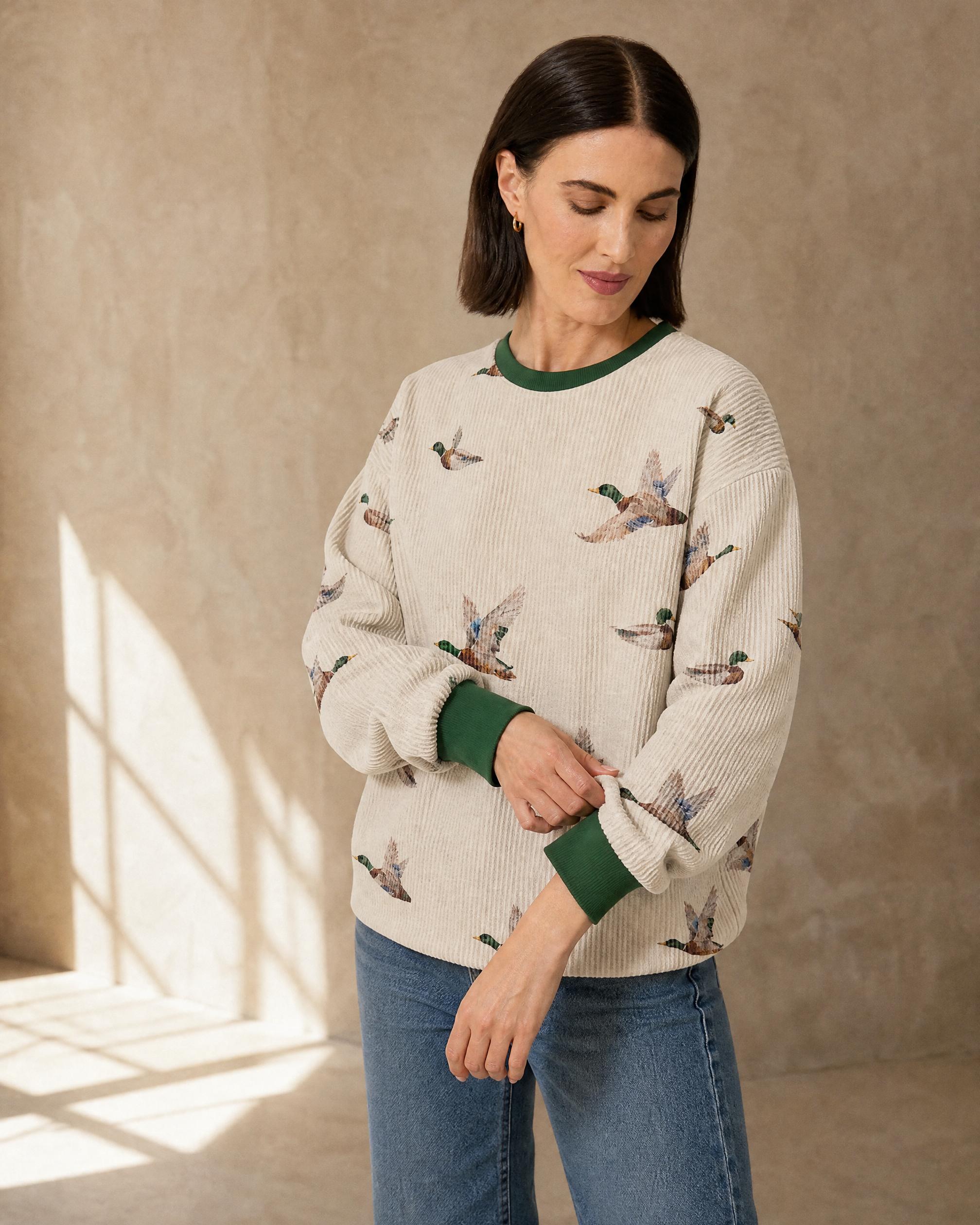 Womens Relaxed-fit Pullover Sweatshirt With An Animal Print in Beige, adjusting the sleeve, worn by model