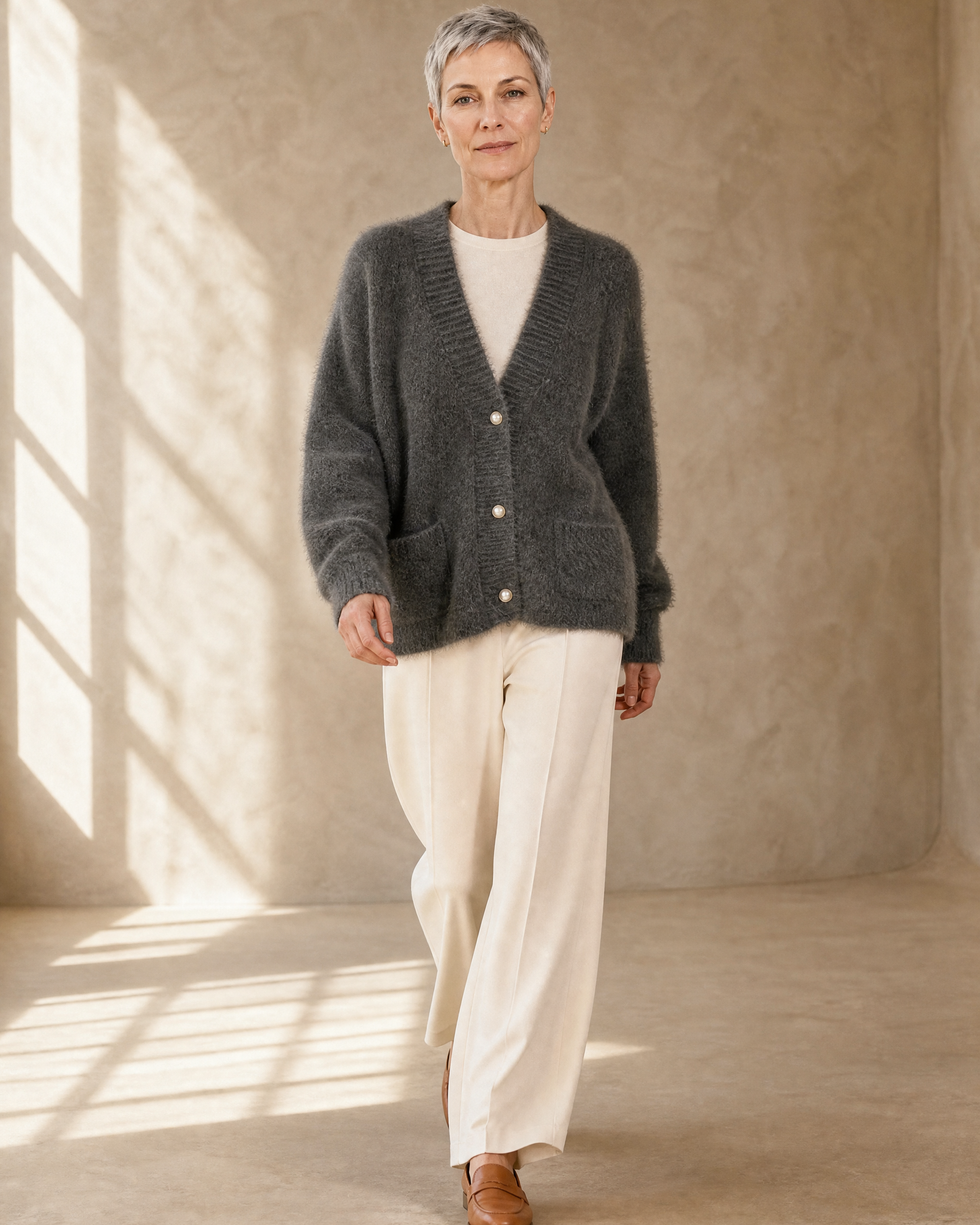 Women's Fuzzy Button Cardigan with Patch Pockets in Grey, walking toward camera, worn by model