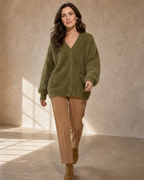 Women's V-Neck Button Cardigan with Pockets in Army Green, walking toward camera, worn by model
