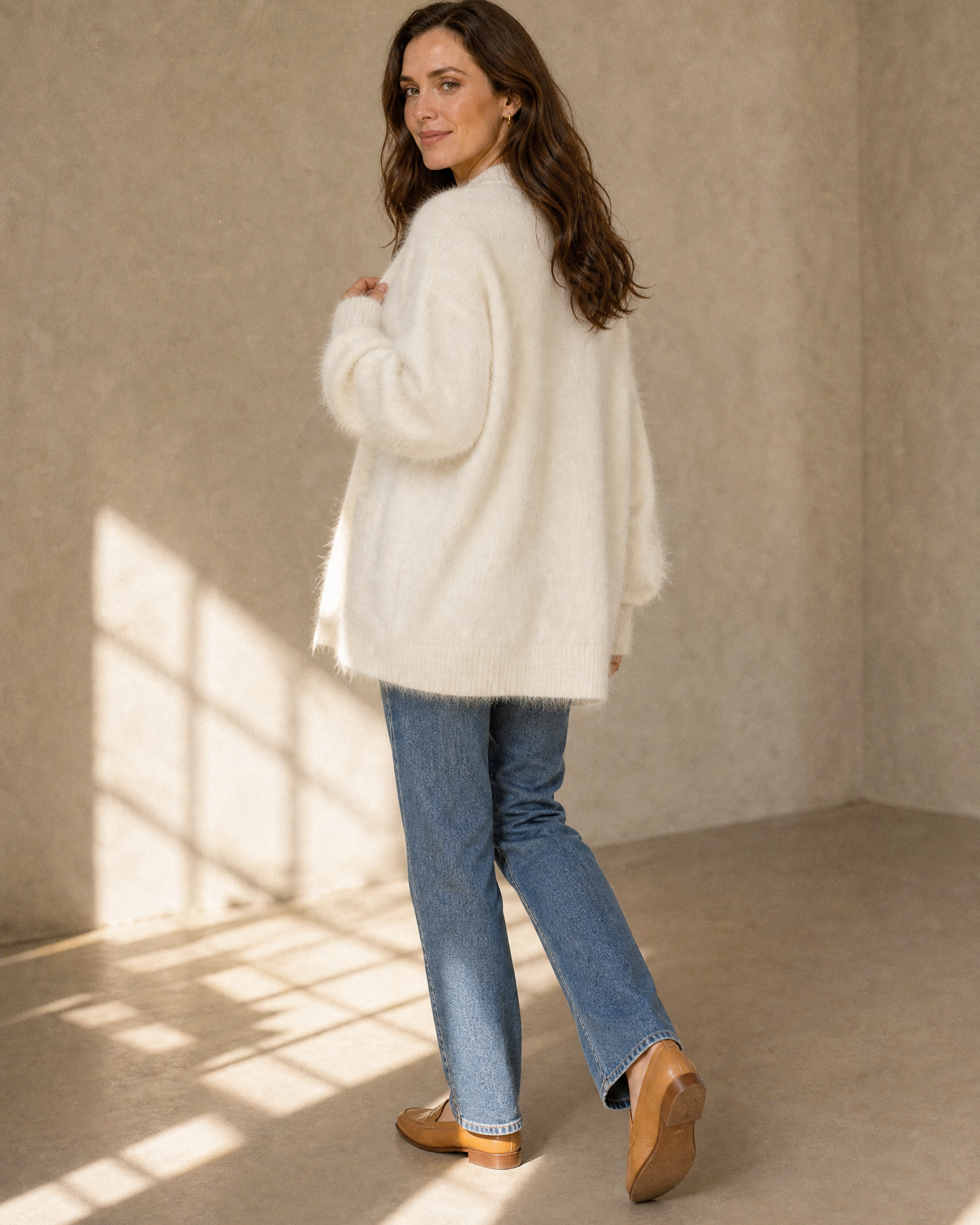 Women's V-Neck Button Cardigan with Pockets in White, walking away, glance back, worn by model