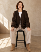 Women's V-Neck Button Cardigan with Pockets in Brown, stool, facing camera, worn by model