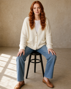 Women's Fuzzy Button Cardigan with Patch Pockets in White, stool, facing camera, worn by model