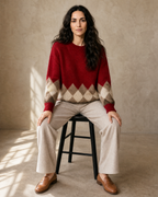 Women's Colour Block Argyle Knit Sweater in Red, stool, facing camera, worn by model