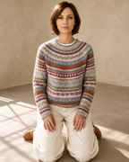 Women's Multicolour Patterned Crew Neck Sweater in Purple, kneeling upright, worn by model