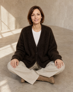 Women's V-Neck Button Cardigan with Pockets in Brown, floor, cross-legged, worn by model