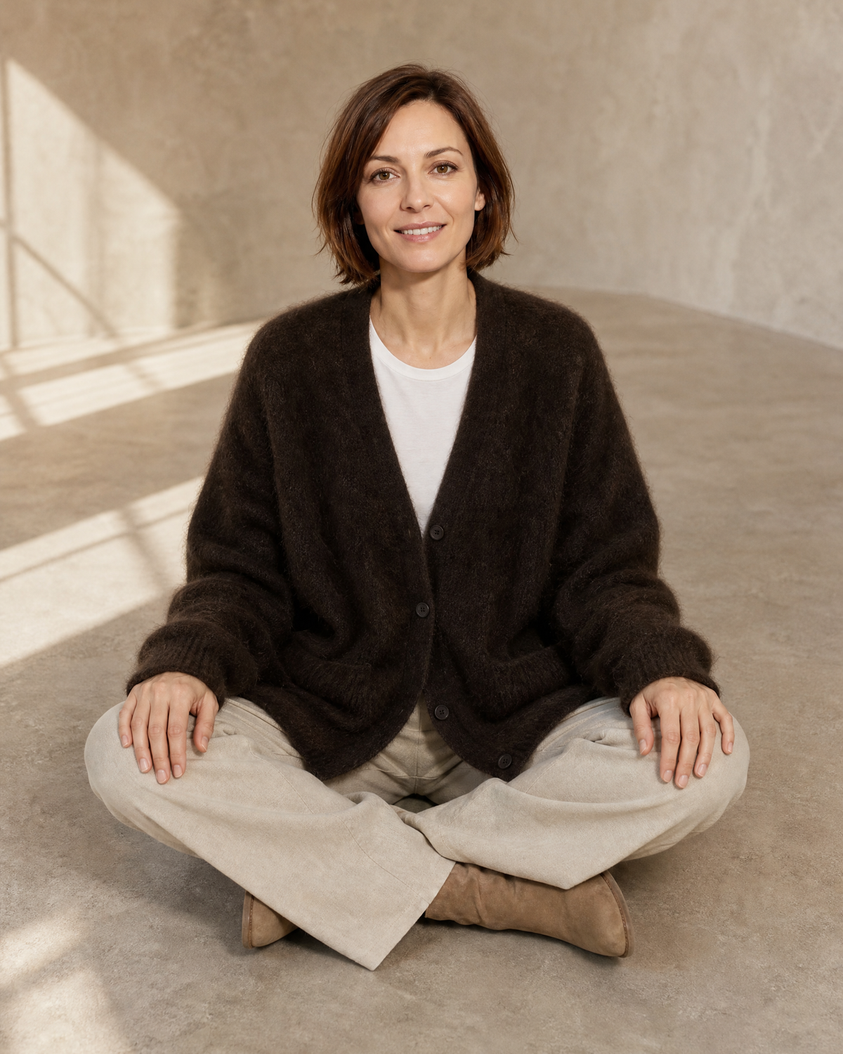 Women's V-Neck Button Cardigan with Pockets in Brown, floor, cross-legged, worn by model