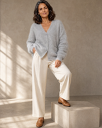 Women's V-Neck Button Cardigan with Pockets in Light Gray, step onto plinth, worn by model