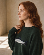 Women's Relaxed Fish Motif Knit Sweater in Dark Green, over-shoulder profile detail, worn by model