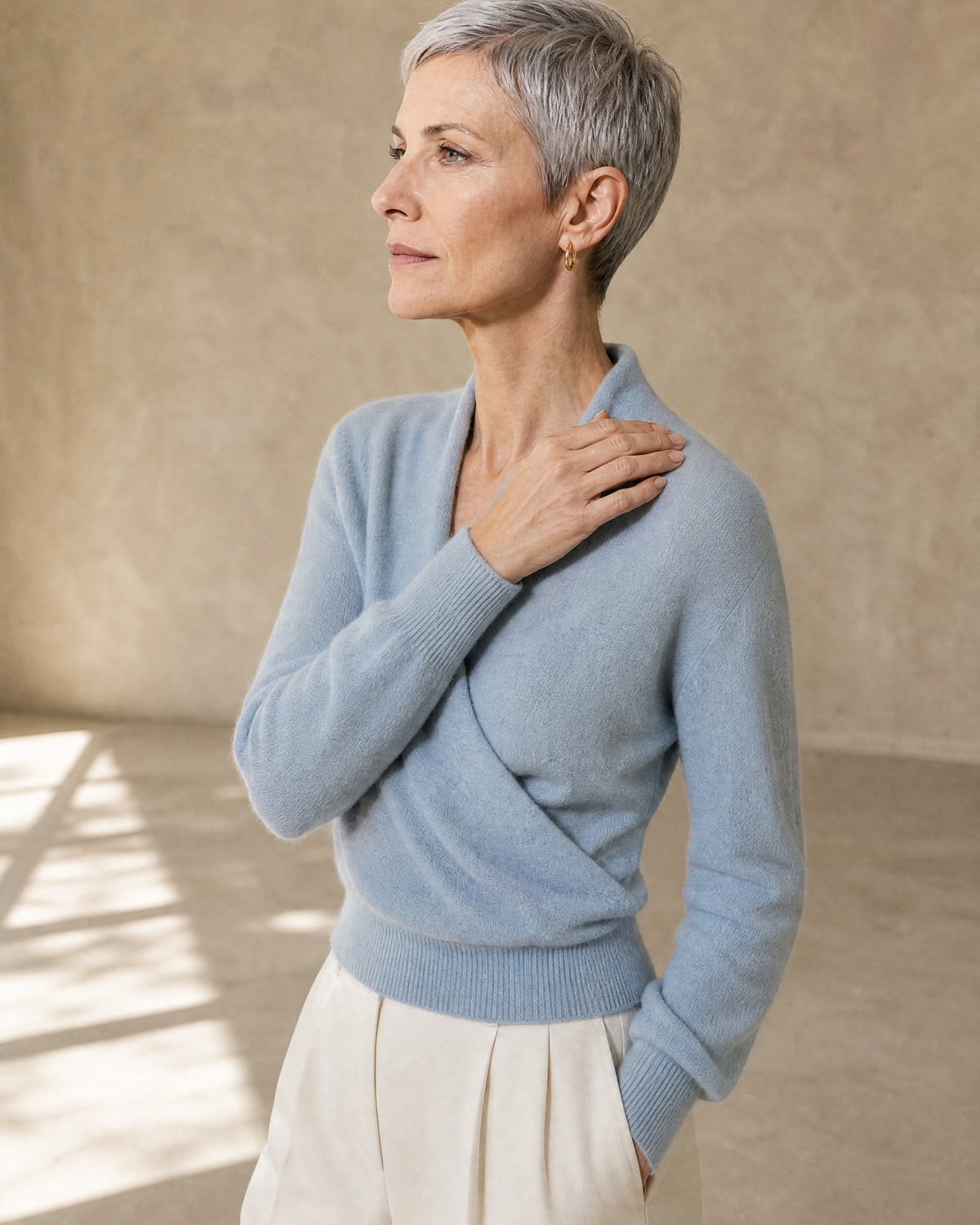 Women's Wrap V-Neck Knit Sweater for Everyday Layering in Stone blue, over-shoulder profile detail, worn by model