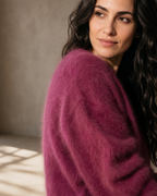 Women's V-Neck Button Cardigan with Pockets in Dark Violet, texture macro on shoulder, worn by model