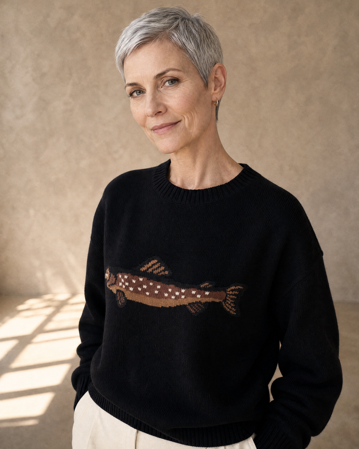 Women's Relaxed Fish Motif Knit Sweater in Black, neckline three-quarter portrait, worn by model