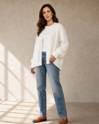 Women's V-Neck Button Cardigan with Pockets in White, half turn, hand at hem, worn by model