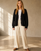 Women's Fuzzy Button Cardigan with Patch Pockets in Black, open stance, arms relaxed, worn by model