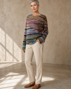 Women's Fashionable Pullover Sweater Top in Rainbow, one hand in pocket, half turn, worn by model