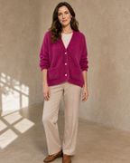 Women's Fuzzy Button Cardigan with Patch Pockets in Rose Red, sleeves pushed, arms down, worn by model