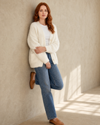 Women's Fuzzy Button Cardigan with Patch Pockets in White, wall lean, arms crossed low, worn by model