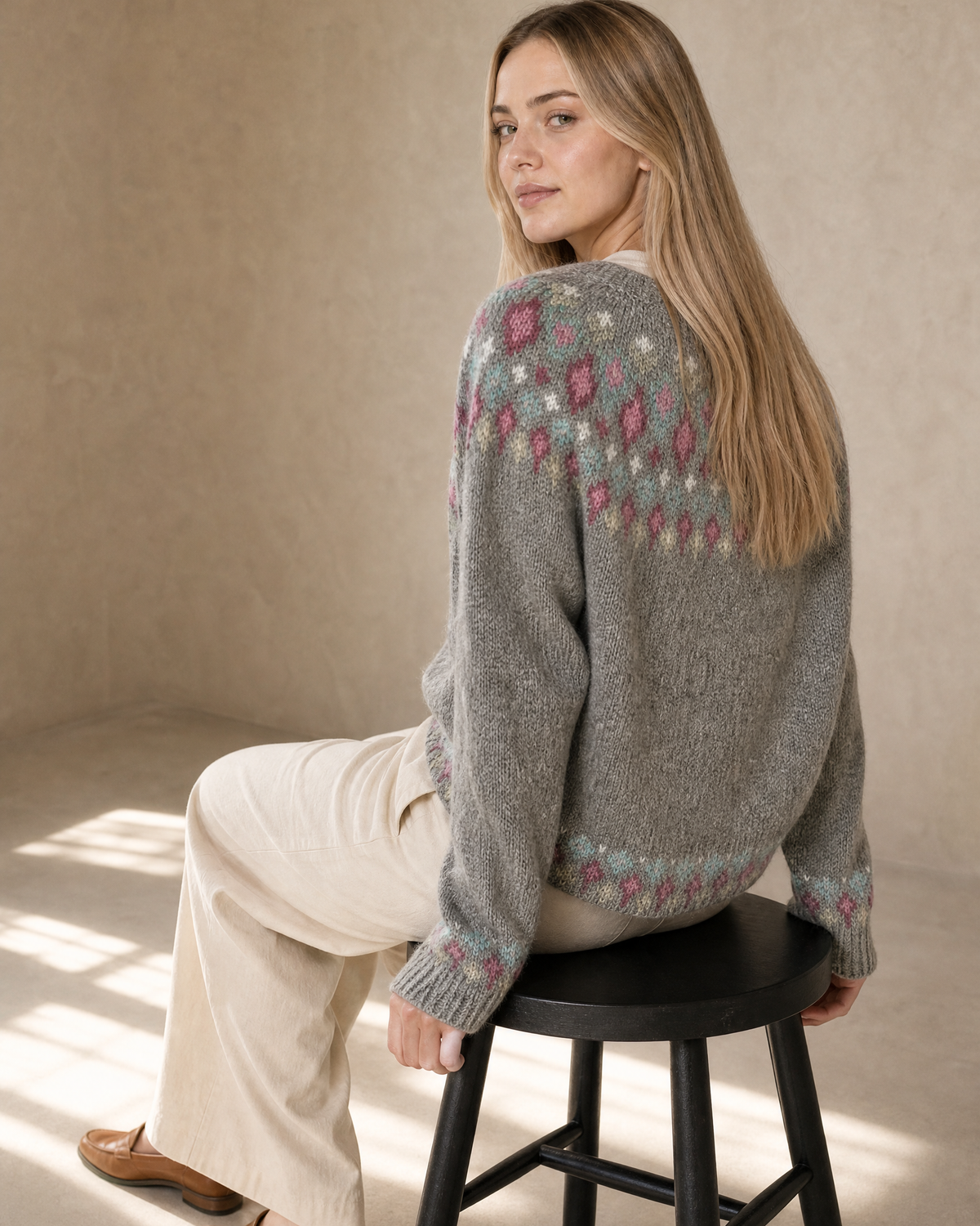 Women's Multicolour Patterned Crew Neck Sweater in Pink Diamond, stool, turned away, head back, worn by model