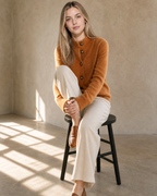 Women's Stand Collar Button Front Cardigan in Caramel Color, stool, one knee drawn up, worn by model