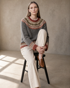 Women's Multicolour Patterned Crew Neck Sweater in Dark Gray, stool, one knee drawn up, worn by model