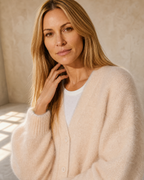 Women's V-Neck Button Cardigan with Pockets in Apricot, shoulder and neckline detail, worn by model