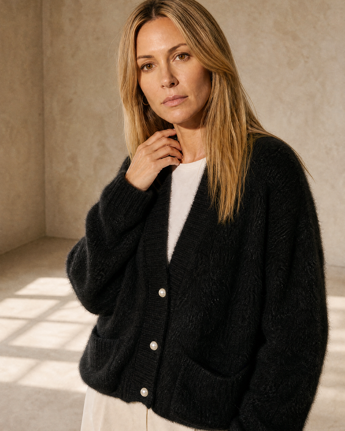 Women's Fuzzy Button Cardigan with Patch Pockets in Black, shoulder and neckline detail, worn by model