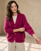Women's Fuzzy Button Cardigan with Patch Pockets in Rose Red, sleeve held away, worn by model