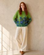 Women's Multicolour Patterned Crew Neck Sweater in Emerald green, wall lean, hands behind hips, worn by model
