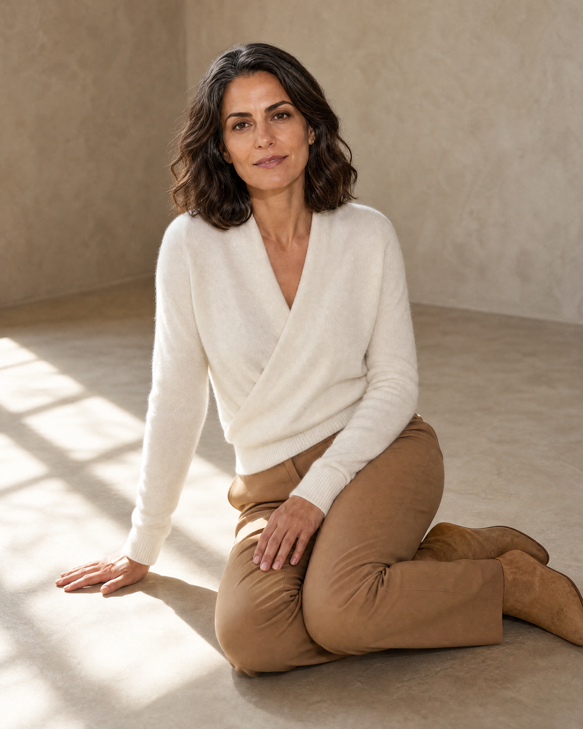 Women's Wrap V-Neck Knit Sweater for Everyday Layering in Milk white, floor, knees to one side, worn by model