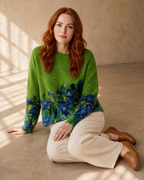 Women's Multicolour Patterned Crew Neck Sweater in Emerald green, floor, knees to one side, worn by model