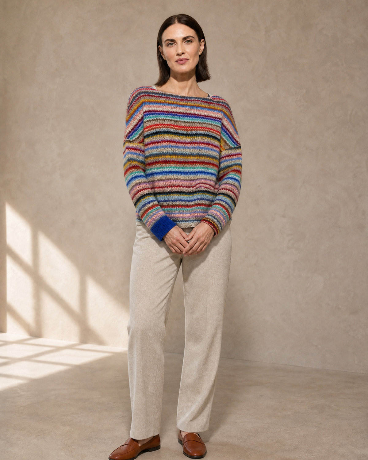Women's Multicolour Patterned Crew Neck Sweater in Rainbow Bar, standing, hands softly clasped, worn by model