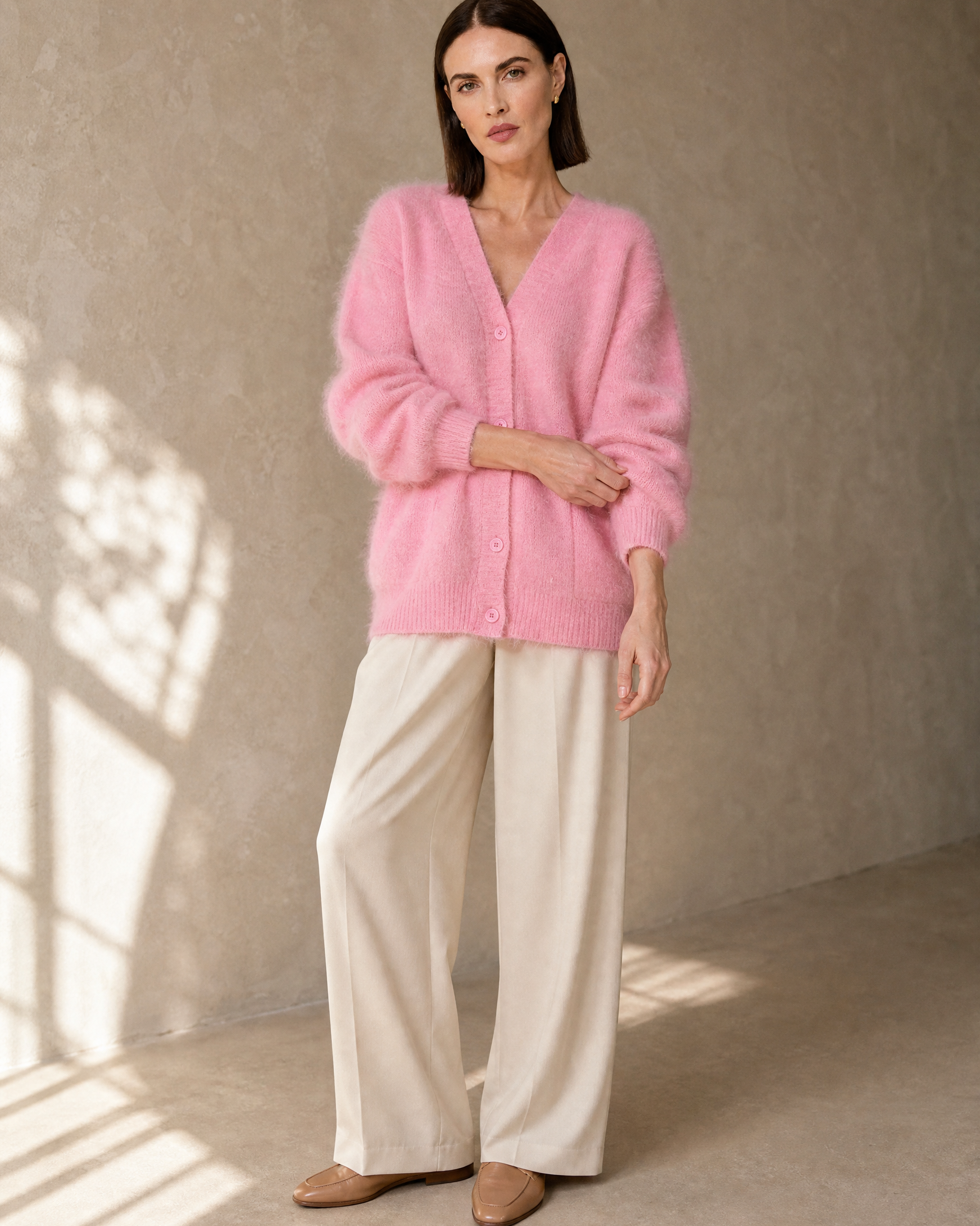 Women's V-Neck Button Cardigan with Pockets in Pink, standing, sleeve adjust, worn by model