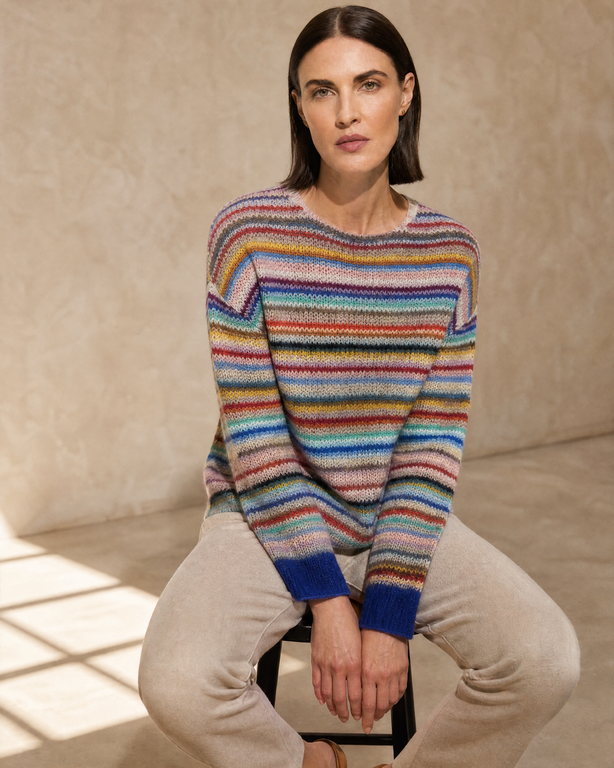 Women's Multicolour Patterned Crew Neck Sweater in Rainbow Bar, stool, forward perch, worn by model