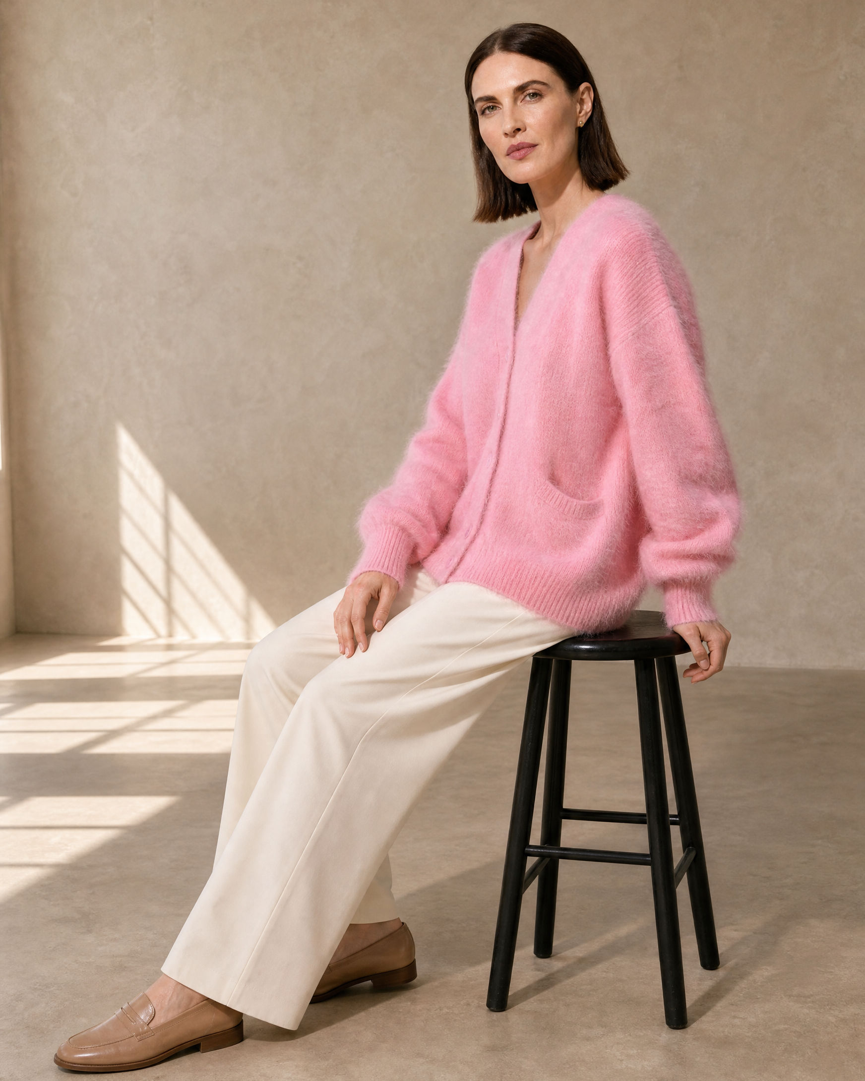 Women's V-Neck Button Cardigan with Pockets in Pink, stool, turned profile, worn by model