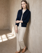 Women's Stand Collar Button Front Cardigan in Navy Blue, wall lean, one hand at sleeve, worn by model