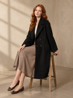 Warm editorial room · Soft sophisticated / old money Black seated or lean