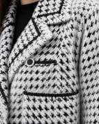 White cardigan — texture and button detail