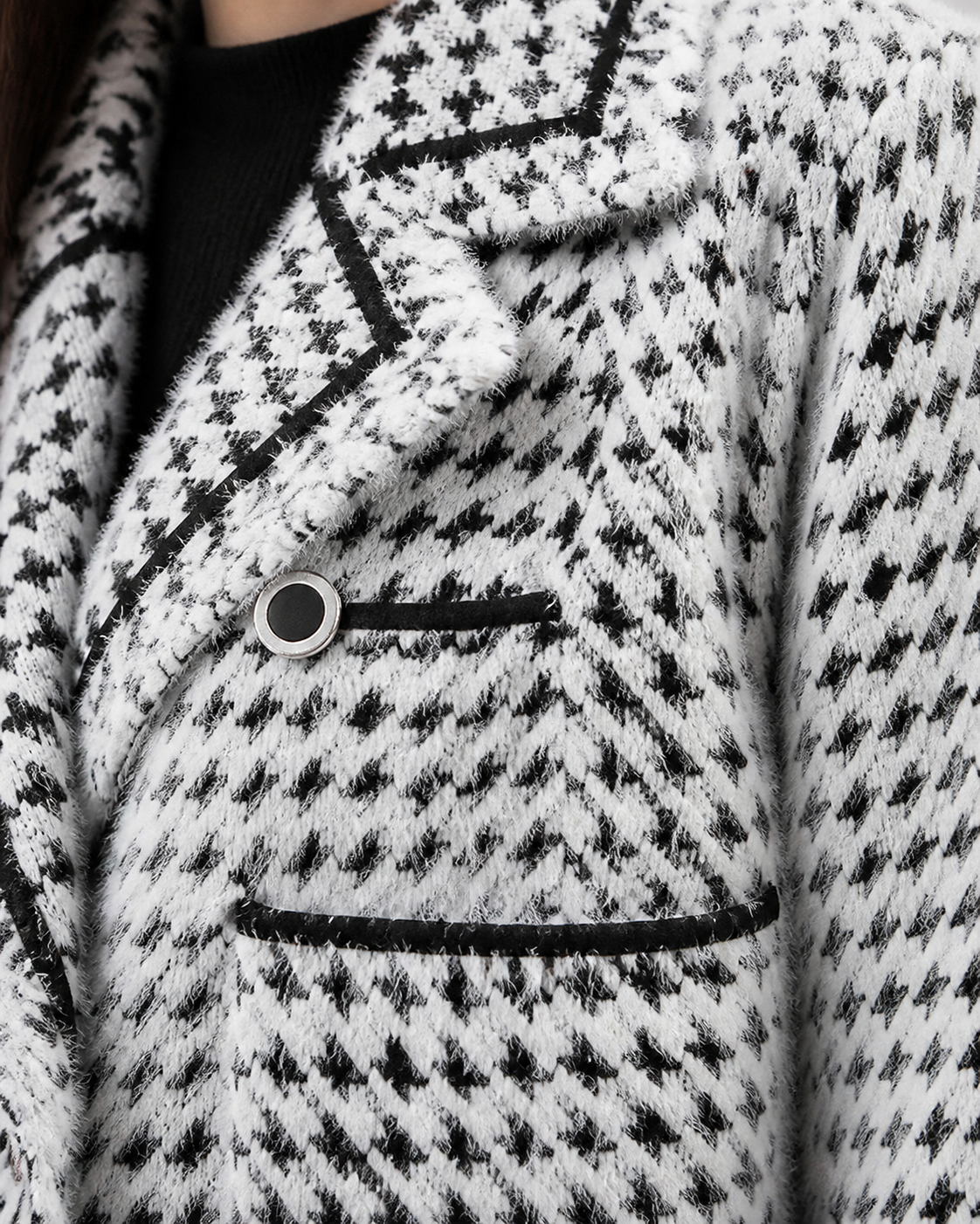 White cardigan — texture and button detail